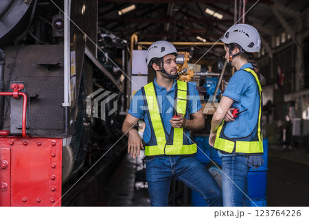 Engineer checking construction process railway and checking work on railroad station .  123764226