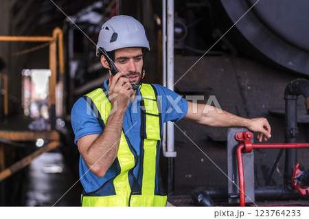 Engineer checking construction process railway and checking work on railroad station . Engineer checking construction process railway and checking work on railroad station . 123764233
