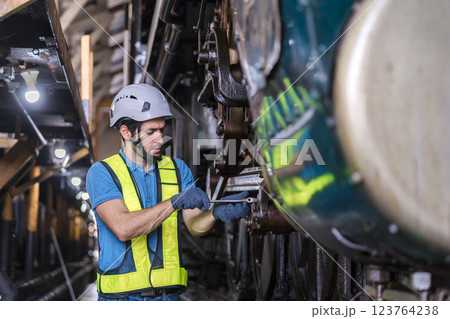 Engineer checking construction process railway and checking work on railroad station . Engineer checking construction process railway and checking work on railroad station . 123764238