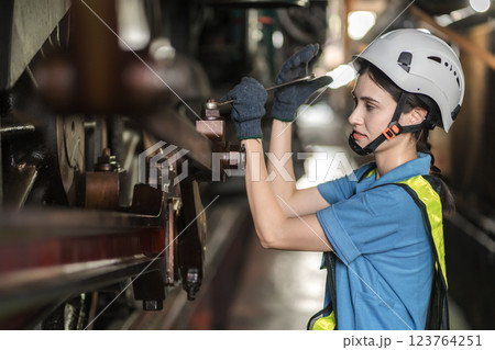 Engineer checking construction process railway and checking work on railroad station .  123764251