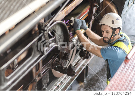 Engineer checking construction process railway and checking work on railroad station . Engineer checking construction process railway and checking work on railroad station . 123764254