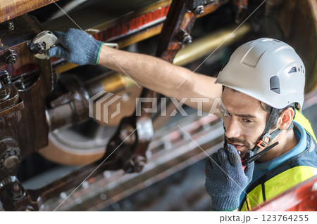Engineer checking construction process railway and checking work on railroad station . Engineer checking construction process railway and checking work on railroad station . 123764255