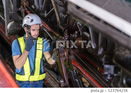 Engineer checking construction process railway and checking work on railroad station .  123764256