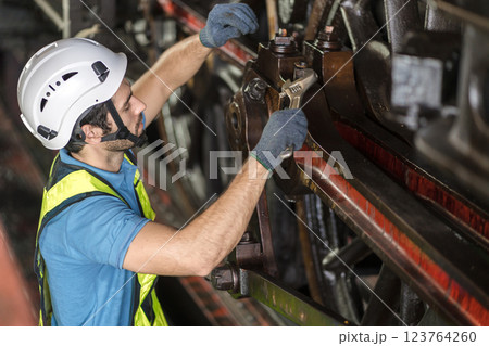 Engineer checking construction process railway and checking work on railroad station .  123764260
