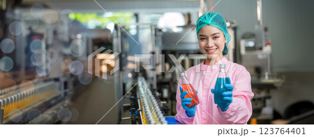 Worker Checking quality or checking stock of glass bottle in beverage factory Worker Checking quality or checking stock of glass bottle in beverage factory 123764401