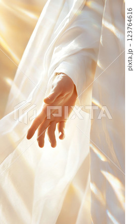 Hand of Jesus reaching out with light in spiritual scene, copy space background Hand of Jesus reaching out with light in spiritual scene, copy space background 123764616