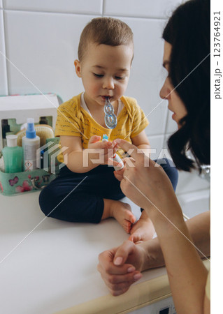 Dental care, mother brushing teeth with boy for wellness,Bathroom, oral health toothbrush 123764921