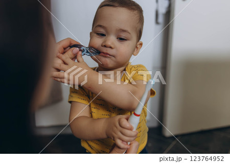 Dental care, mother brushing teeth with boy for wellness,Bathroom, oral health toothbrush 123764952
