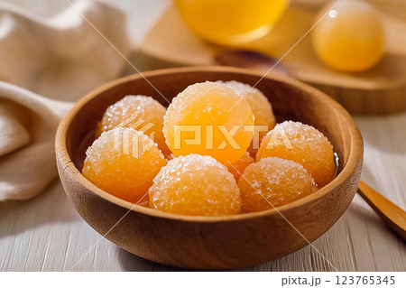 Traditional Brazilian bala baiana dessert preparation with coconut balls coated in sugar. Traditional Brazilian bala baiana dessert preparation with coconut balls coated in sugar. 123765345