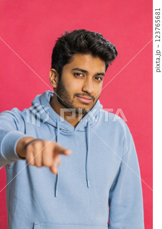 Happy Indian smiling man pointing finger to camera making winner choice, showing direction, select Happy Indian smiling man pointing finger to camera making winner choice, showing direction, select 123765681
