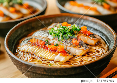 Fish noodle soup served in a beautifully designed bowl, showcasing the local culinary heritage Fish noodle soup served in a beautifully designed bowl, showcasing the local culinary heritage 123765703