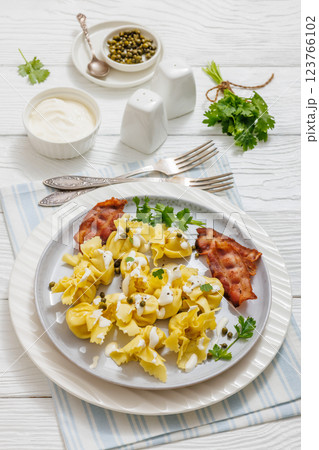 sacchettoni, pasta with bacon and cheese filling 123766102