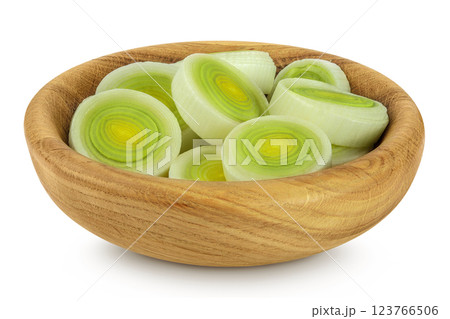 sliced Leek vegetable in wooden bowl isolated on white background with full depth of field 123766506