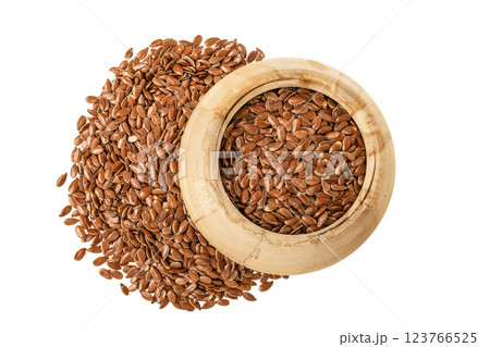 flaxseed in wooden bowl isolated on white background. Top view. Flat lay 123766525
