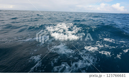 Side view from boat in Indian ocean sailing between Seychelles islands in daytime with big waves 123766681
