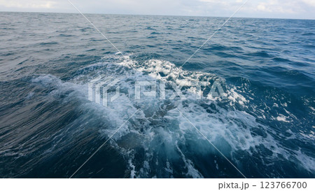 Side view from boat in Indian ocean sailing between Seychelles islands in daytime with big waves 123766700