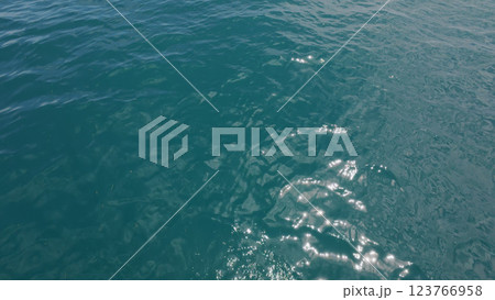 Turquoise Blue Indian ocean waves closeup from boat 123766958