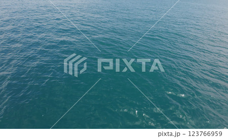 Turquoise Blue Indian ocean waves closeup from boat 123766959