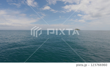 Side view from boat in Indian ocean sailing between Seychelles islands in daytime Side view from boat in Indian ocean sailing between Seychelles islands in daytime 123766960