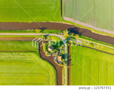 Drone view of the windmill. Landscape from a drone in the Netherlands. Drone view of the windmill. Landscape from a drone in the Netherlands. 123767351