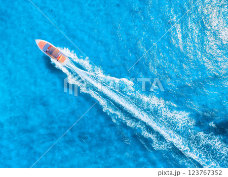 Drone view on fast boat on blue Mediterranean sea at sunny day. Vacation and leisure Drone view on fast boat on blue Mediterranean sea at sunny day. Vacation and leisure 123767352