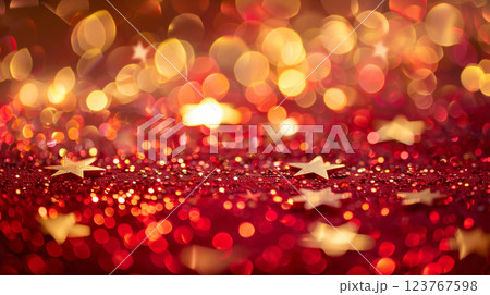Golden and red stars and glitter creating an abstract festive background. Perfect for themes of celebrations, parties, and creative designs. 123767598
