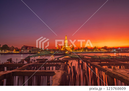 Twilight view of Wat Arun Ratchawararam Ratchawaramahawihan at sunset in bangkok Thailand. Landmark of Along the Chao Phraya River Thailand 123768609