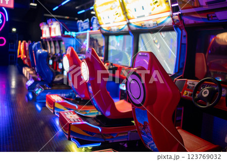 Gaming chairs in illuminated arcade game zone in 123769032