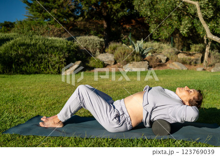 Senior woman releasing back muscles with MFR 123769039
