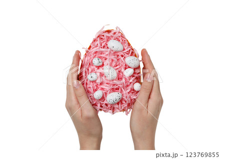 PNG, Easter, egg formed from paper shavings with quail eggs, with hands, isolated on white background 123769855