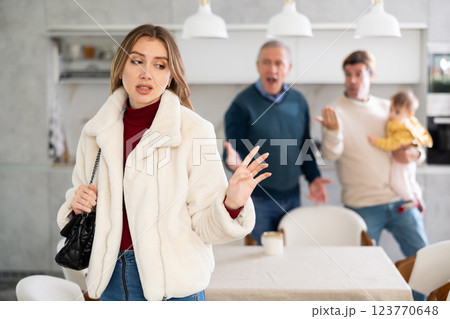 Two men quarreling with young woman 123770648