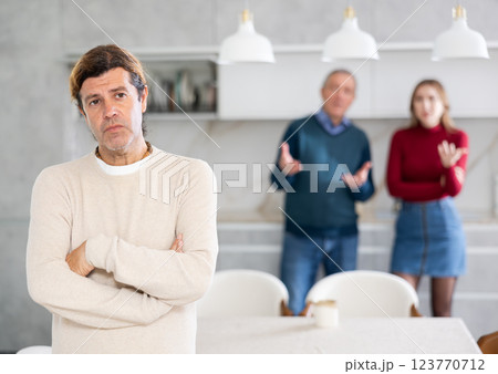 Man and girl quarrel with older man 123770712