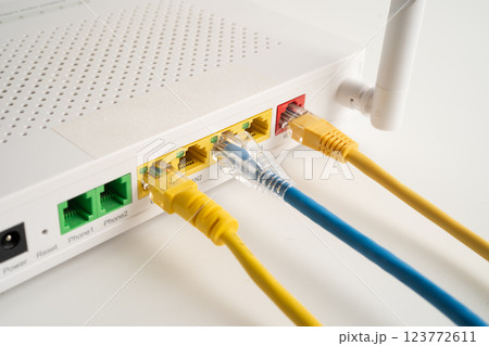 Ethernet cable with wireless router connect to internet service provider internet network. Ethernet cable with wireless router connect to internet service provider internet network. 123772611