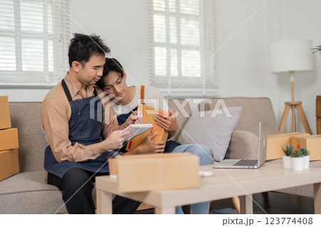 Collaborative social media marketers brainstorming product strategies in their cozy home office Collaborative social media marketers brainstorming product strategies in their cozy home office 123774408