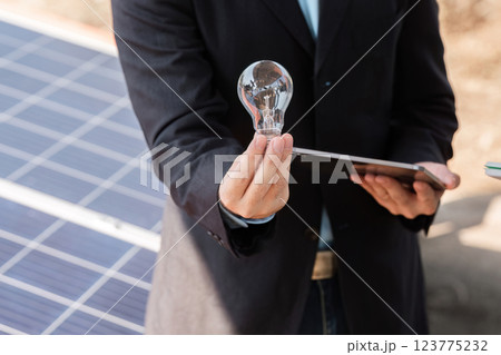 Sustainable business demonstration. Professional showcasing innovations in solar energy solutions. 123775232