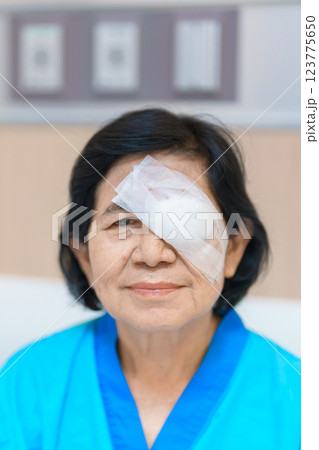 Elderly Woman with eye protective shield after eye surgery. Eye disease, Cataract,  Glaucoma, Age Related Macular Degeneration, Diabetic Retinopathy, Vitreous, Lasik, World Glaucoma day and health 123775650