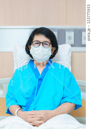 Elderly asian Patient Woman recovery after surgery. Happy Senior illness resting in hospital. Influenza, Fever, treatment, Insurance, Health care and medical, world day of Sick and Health day concept 123775933
