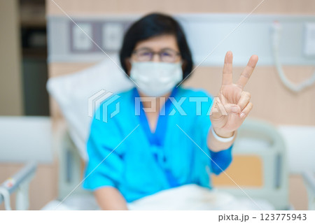 Elderly asian Patient Woman recovery after surgery. Happy Senior illness resting in hospital. Influenza, Fever, treatment, Insurance, Health care and medical, world day of Sick and Health day concept 123775943