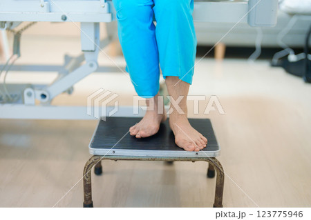 Senior asian Patient Woman step down and up the stairs bed in hospital. Female Elderly resting after surgery. Illness, treatment, Insurance, Health care and medical, world day of Sick and Health day 123775946