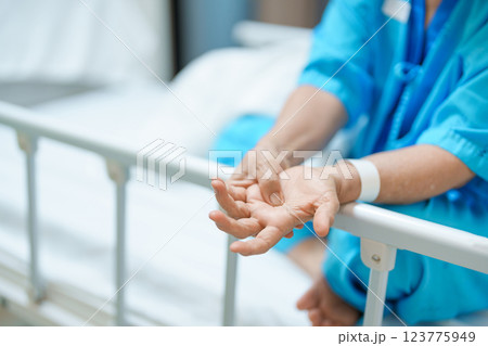 Elderly asian Patient Woman recovery after surgery. Happy Senior illness resting in hospital. Influenza, Fever, treatment, Insurance, Health care and medical, world day of Sick and Health day concept 123775949