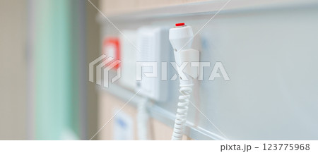 emergency button in hospital room, calling nurse in emergency case. Professional Medical system and Safety Alert emergency button in hospital room, calling nurse in emergency case. Professional Medical system and Safety Alert 123775968