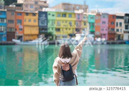 woman traveler visiting in Taiwan, female Tourist with backpack sightseeing at Keelung, Colorful Zhengbin Fishing Port. Popular landmarks and attractions near Taipei City. Asia Travel concept woman traveler visiting in Taiwan, female Tourist with backpack sightseeing at Keelung, Colorful Zhengbin Fishing Port. Popular landmarks and attractions near Taipei City. Asia Travel concept 123776415