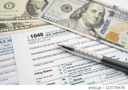 Tax form 1040 U.S. Individual Income Tax Return and bitcoin, business finance, Digital currency, Virtual cryptocurrency. 123776476