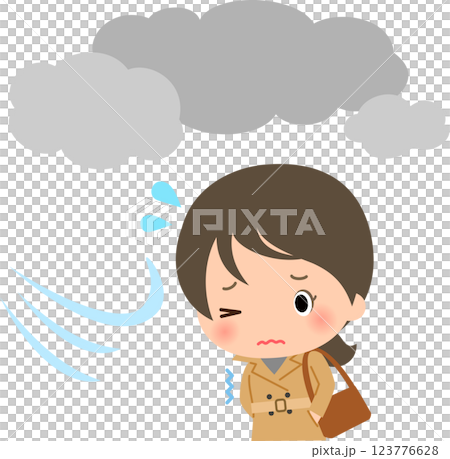 曇天の下を寒そうに歩くトレンチコートの女性 123776628