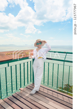 Woman tourist traveling in Krabi, Thailand. happy traveller enjoy and sightseeing view at koh Hong island viewpoint. summer trip, destination, Southeast Asia Travel, vacation and holiday concept Woman tourist traveling in Krabi, Thailand. happy traveller enjoy and sightseeing view at koh Hong island viewpoint. summer trip, destination, Southeast Asia Travel, vacation and holiday concept 123777967