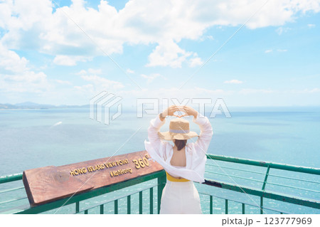 Woman tourist traveling in Krabi, Thailand. happy traveller enjoy and sightseeing view at koh Hong island viewpoint. summer trip, destination, Southeast Asia Travel, vacation and holiday concept 123777969