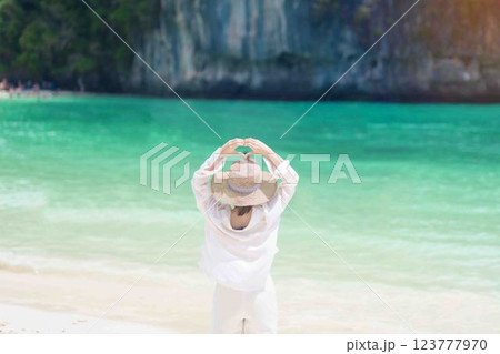 Woman tourist traveling and sightseeing in Krabi, Thailand. happy traveller enjoy on beach at koh Hong island. summer trip, destination, Southeast Asia Travel, vacation and holiday concept 123777970
