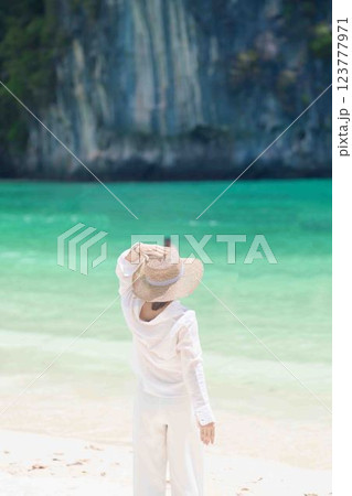 Woman tourist traveling and sightseeing in Krabi, Thailand. happy traveller enjoy on beach at koh Hong island. summer trip, destination, Southeast Asia Travel, vacation and holiday concept 123777971