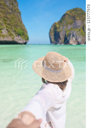 Couple tourist traveling and sightseeing in Krabi, Thailand. happy traveller enjoy at Maya Bay beach on Phi Phi island. Honeymoon trip, destination, Southeast Asia Travel, vacation and holiday concept 123777978