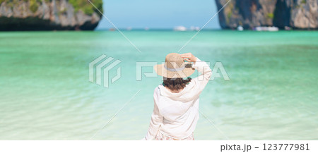 Woman tourist traveling and sightseeing in Krabi, Thailand, happy traveller enjoy at Maya Bay beach on Phi Phi island, Popular paradise island, destination, Southeast Asia Travel, vacation and holiday Woman tourist traveling and sightseeing in Krabi, Thailand, happy traveller enjoy at Maya Bay beach on Phi Phi island, Popular paradise island, destination, Southeast Asia Travel, vacation and holiday 123777981